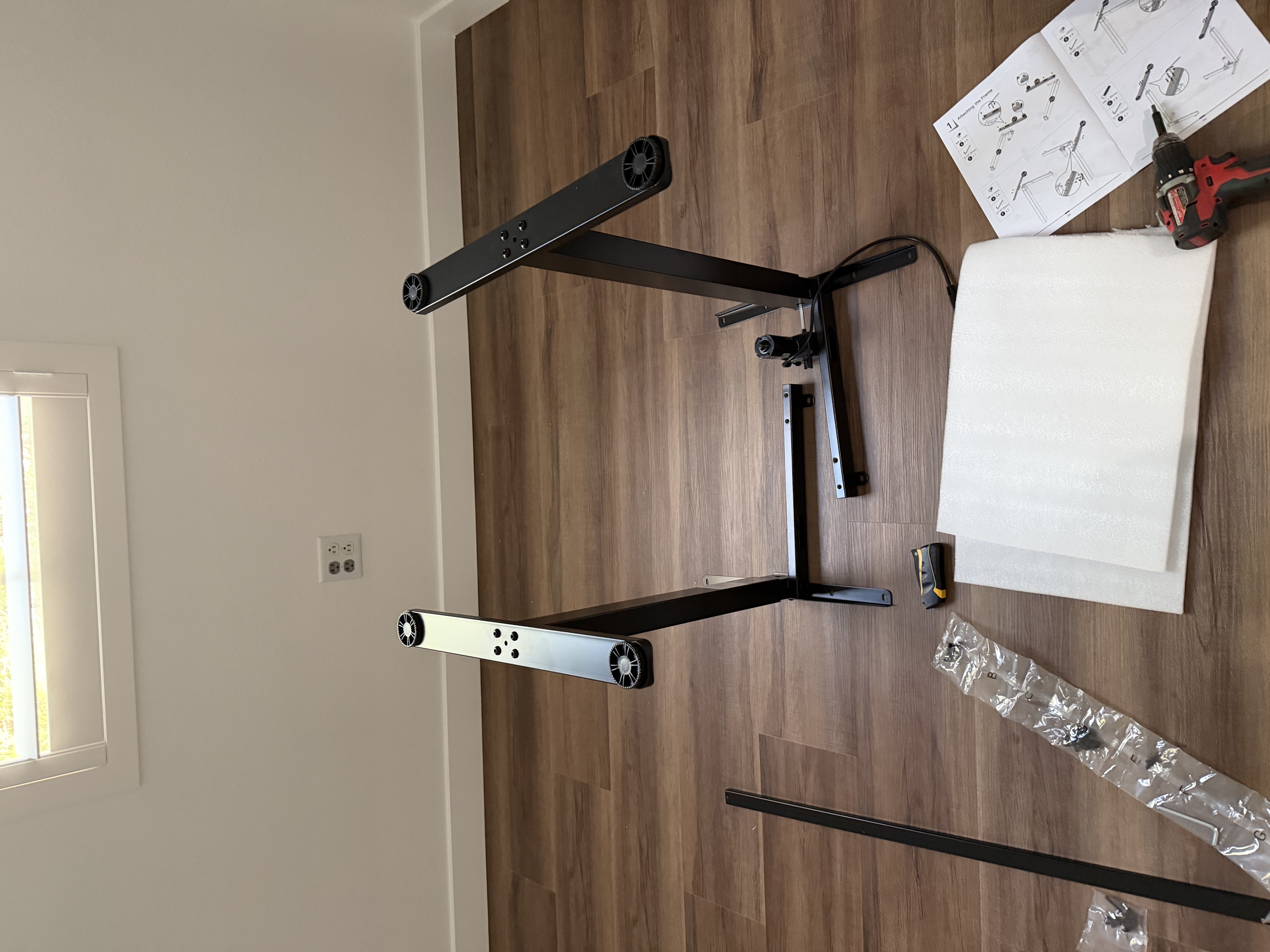 Desk legs and frame being assembled