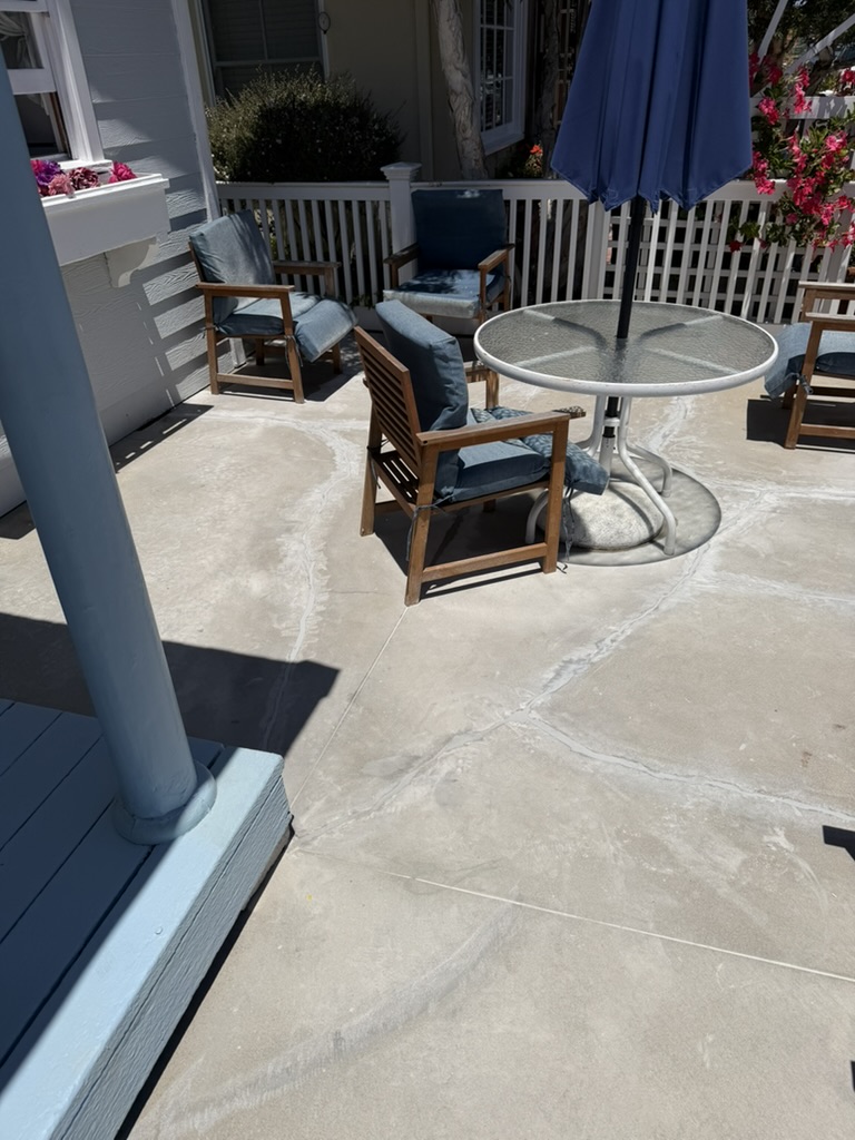 Patio concrete ground down and sealed, furniture set back