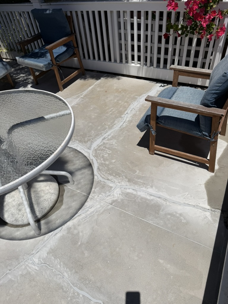 Close-up of repaired and sealed patio concrete surface