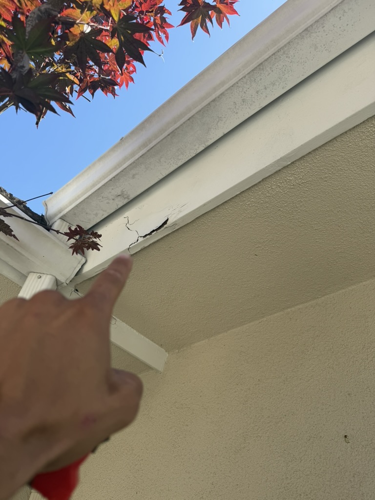 Cracked fascia board pointed out during inspection