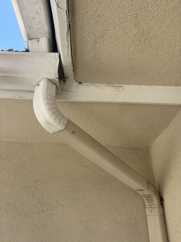 Close-up of cracked and separated fascia board