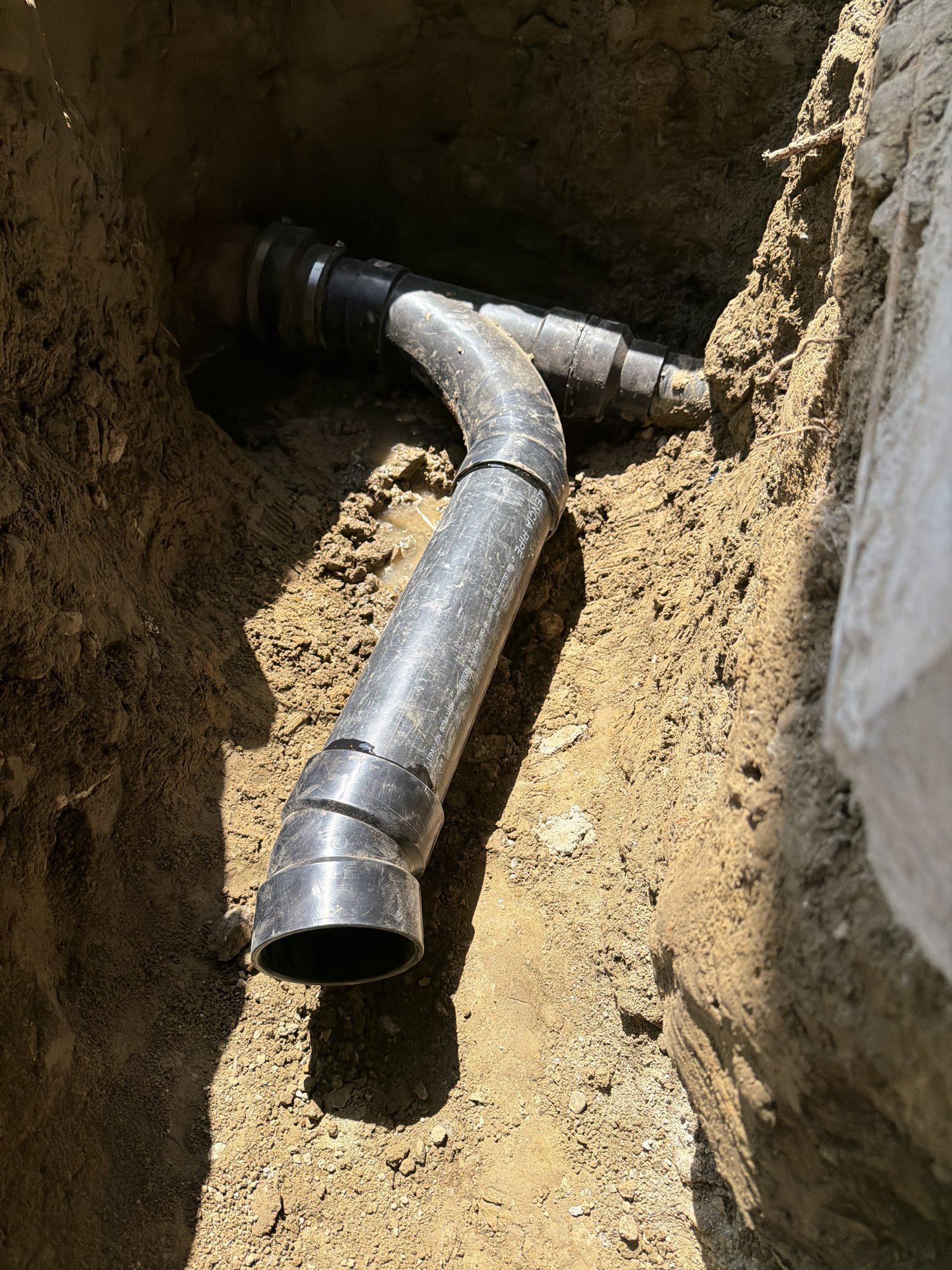 Plumbing fitting routing toward bathroom